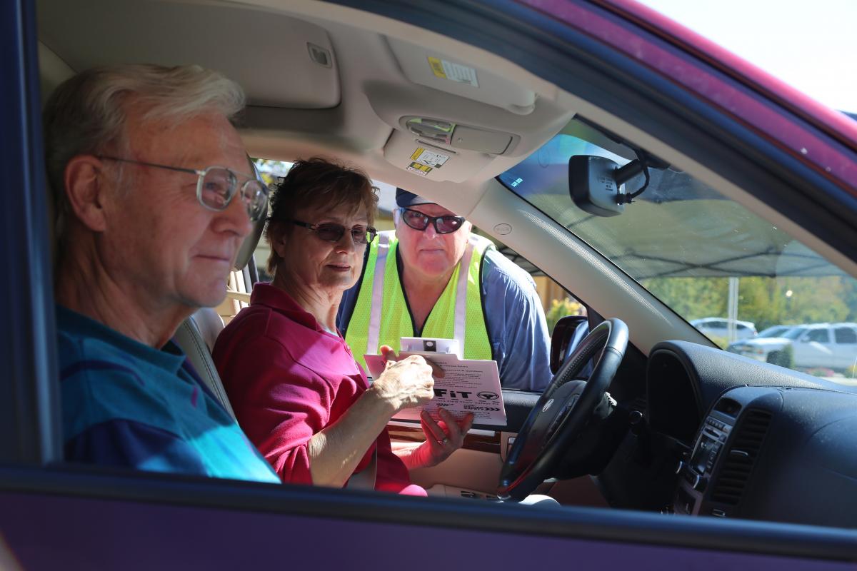Photo of older drivers in car